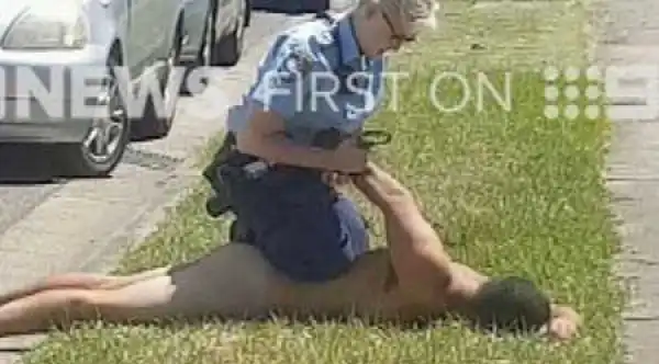 Commotion in Broad Daylight as N*ked Man Appears From Nowhere, Jumps Into Moving Car (Photo)